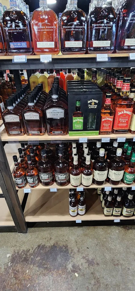 Bourbon and whiskey shelf at Trenton Liquors, including Woodford Reserve and Jack Daniel's